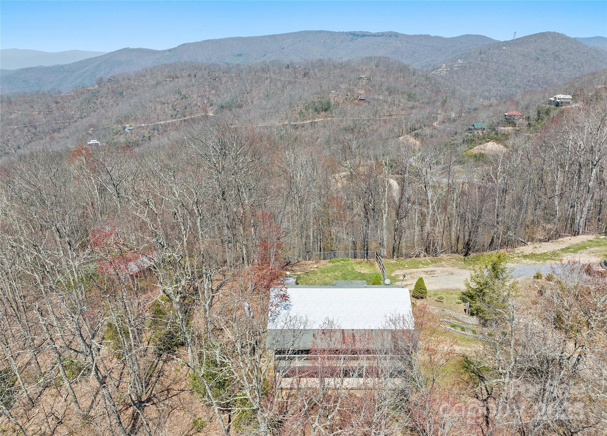 173 Blizzard Ridge Maggie Valley, NC 28751 - Photo 33 of 37 a view of a yard with an outdoor space and seating