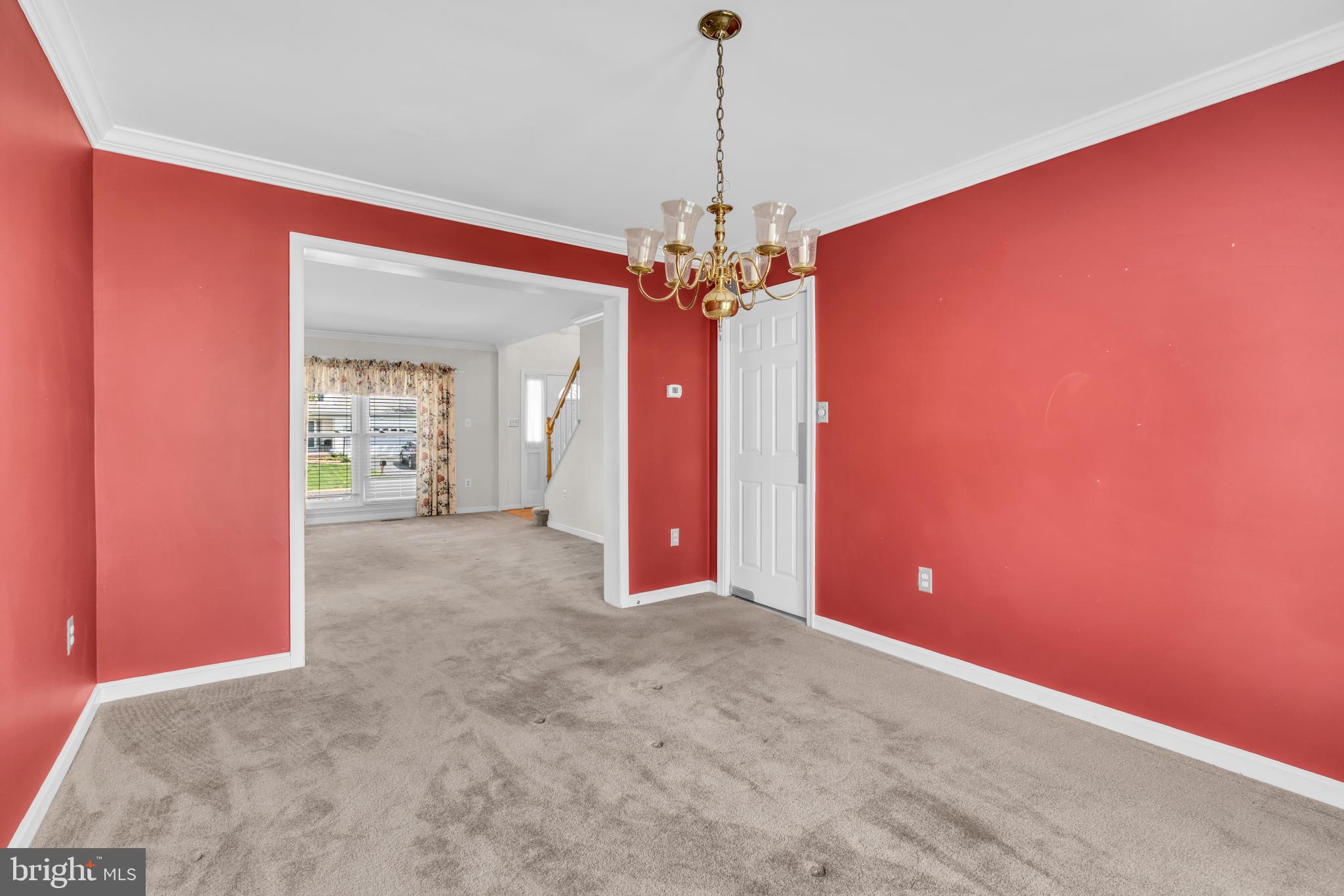 13988 Dancing Twig Drive Gainesville, VA 20155 - Photo 14 of 62 a view of a livingroom with a chandelier fan and windows