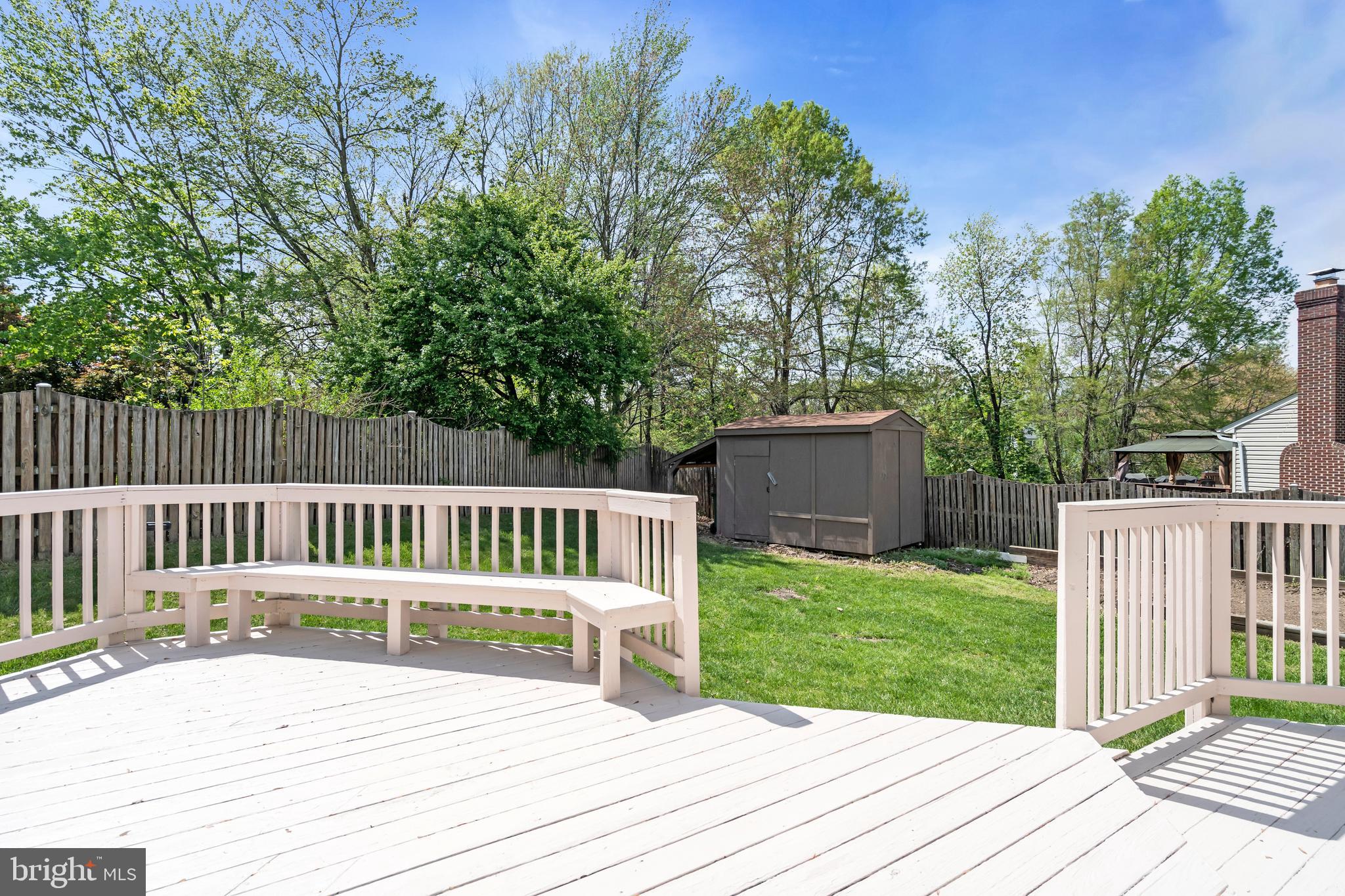 13988 Dancing Twig Drive Gainesville, VA 20155 - Photo 33 of 62 a view of a deck with a wooden fence
