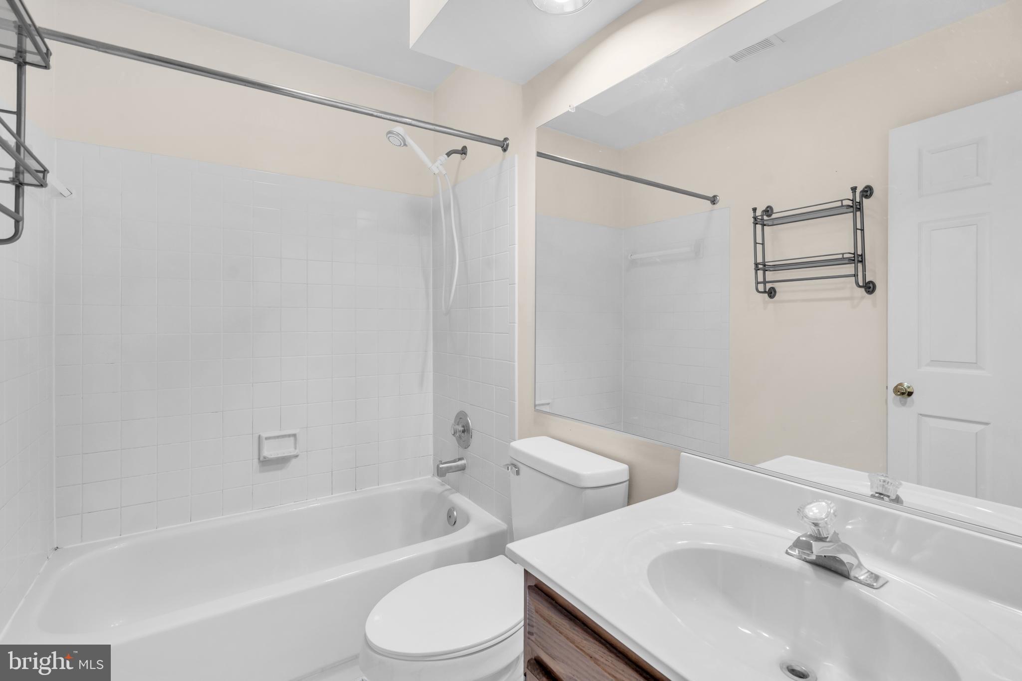 13988 Dancing Twig Drive Gainesville, VA 20155 - Photo 39 of 62 a bathroom with a sink toilet and shower