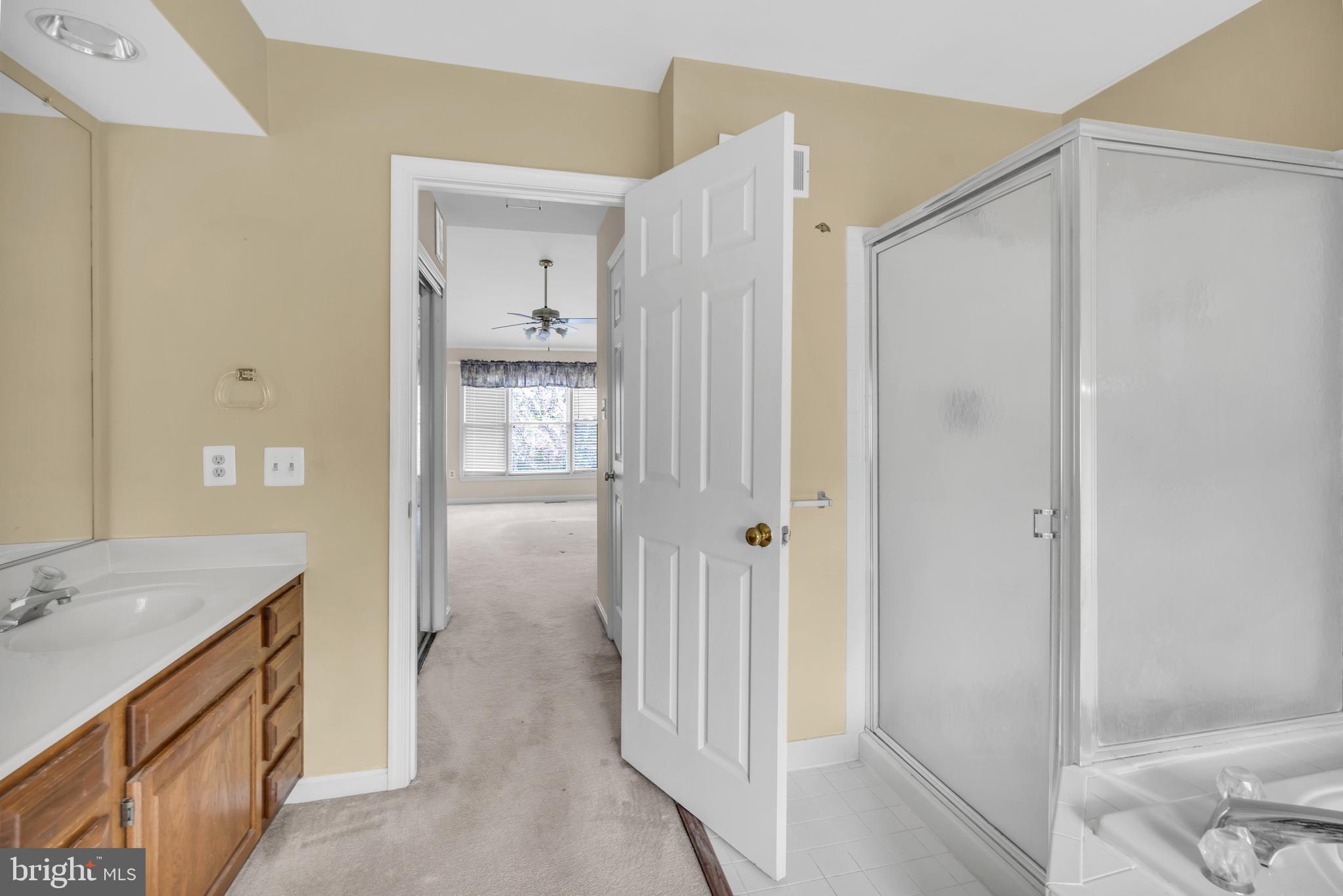 13988 Dancing Twig Drive Gainesville, VA 20155 - Photo 50 of 62 a bathroom with a granite countertop sink and shower