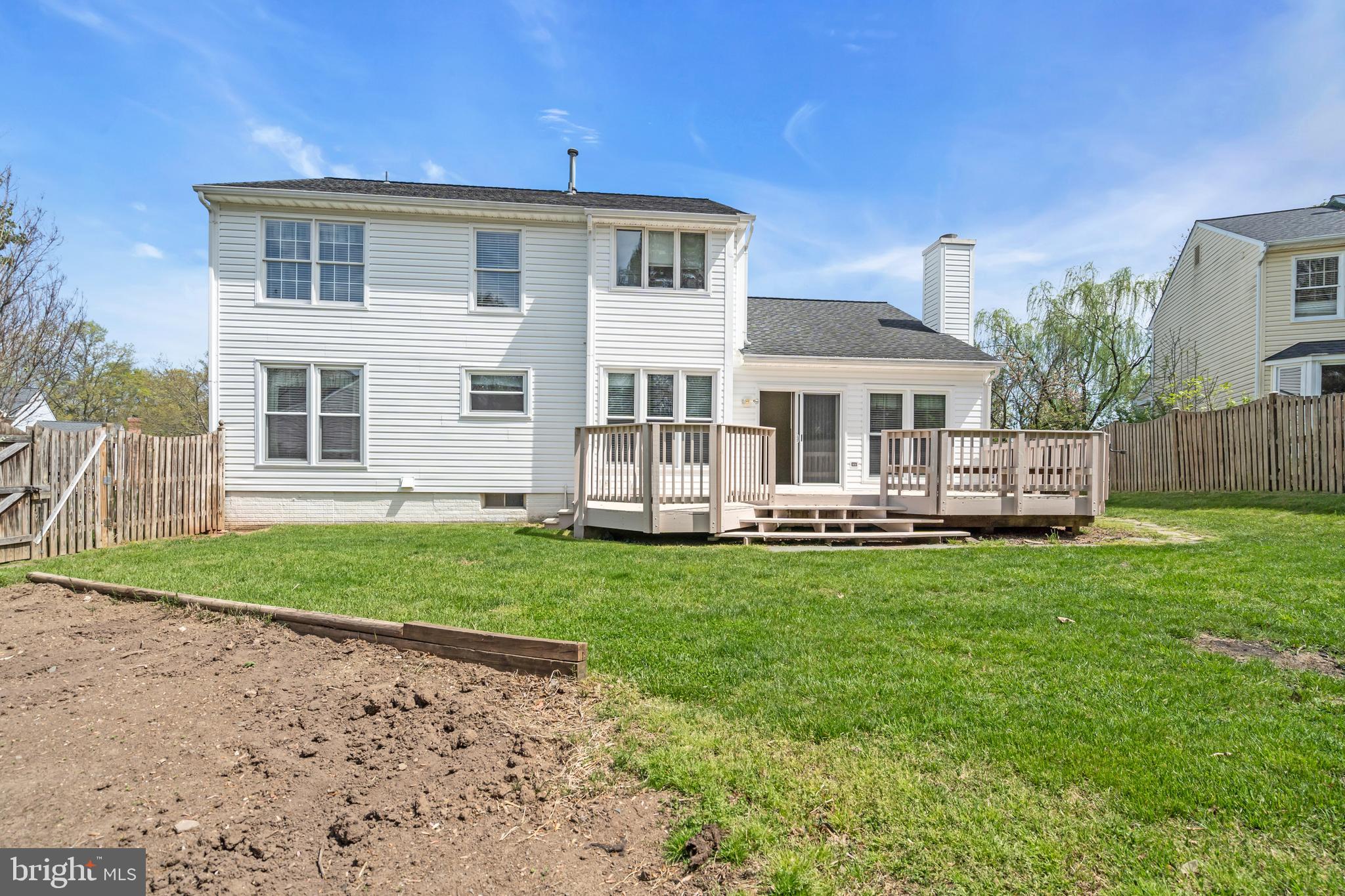 13988 Dancing Twig Drive Gainesville, VA 20155 - Photo 57 of 62 a front view of a house with a yard