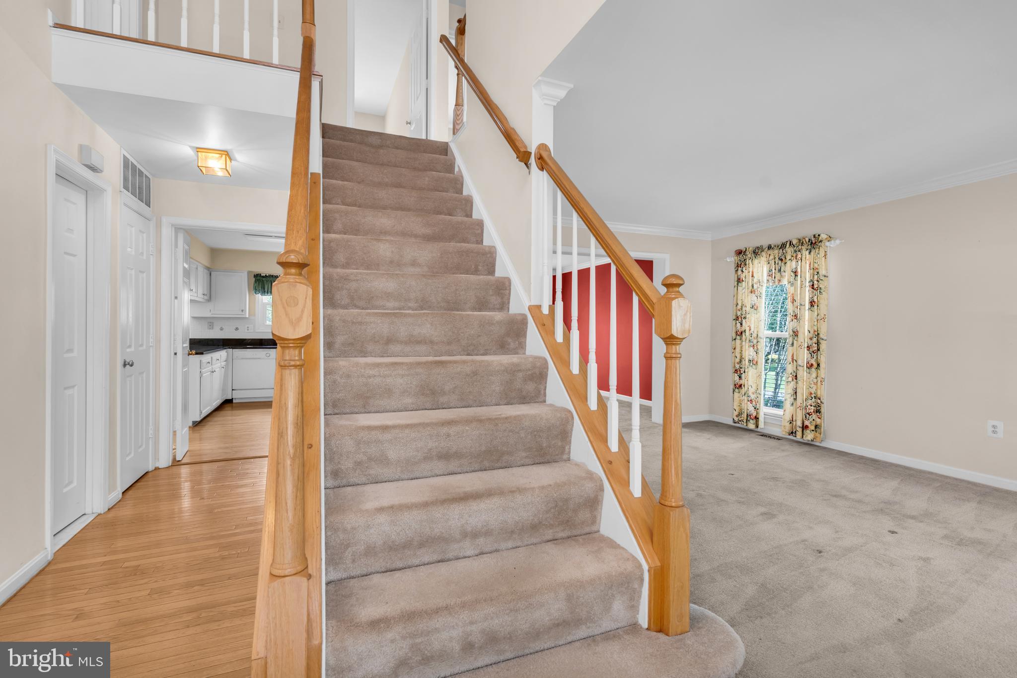 13988 Dancing Twig Drive Gainesville, VA 20155 - Photo 7 of 62 a view of staircase with white walls and door
