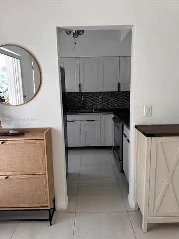 a kitchen with a sink and a stove