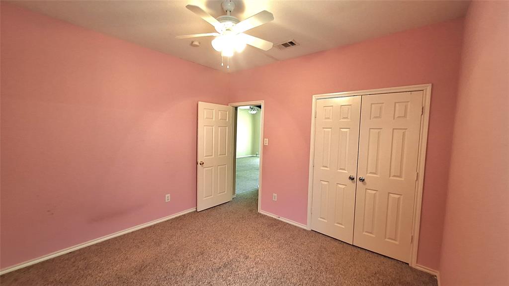 953 Hannah Way Dallas, TX 75253 - Photo 12 of 22 Carpeted room featuring a ceiling fan with integrated lighting, painted walls, and white trim