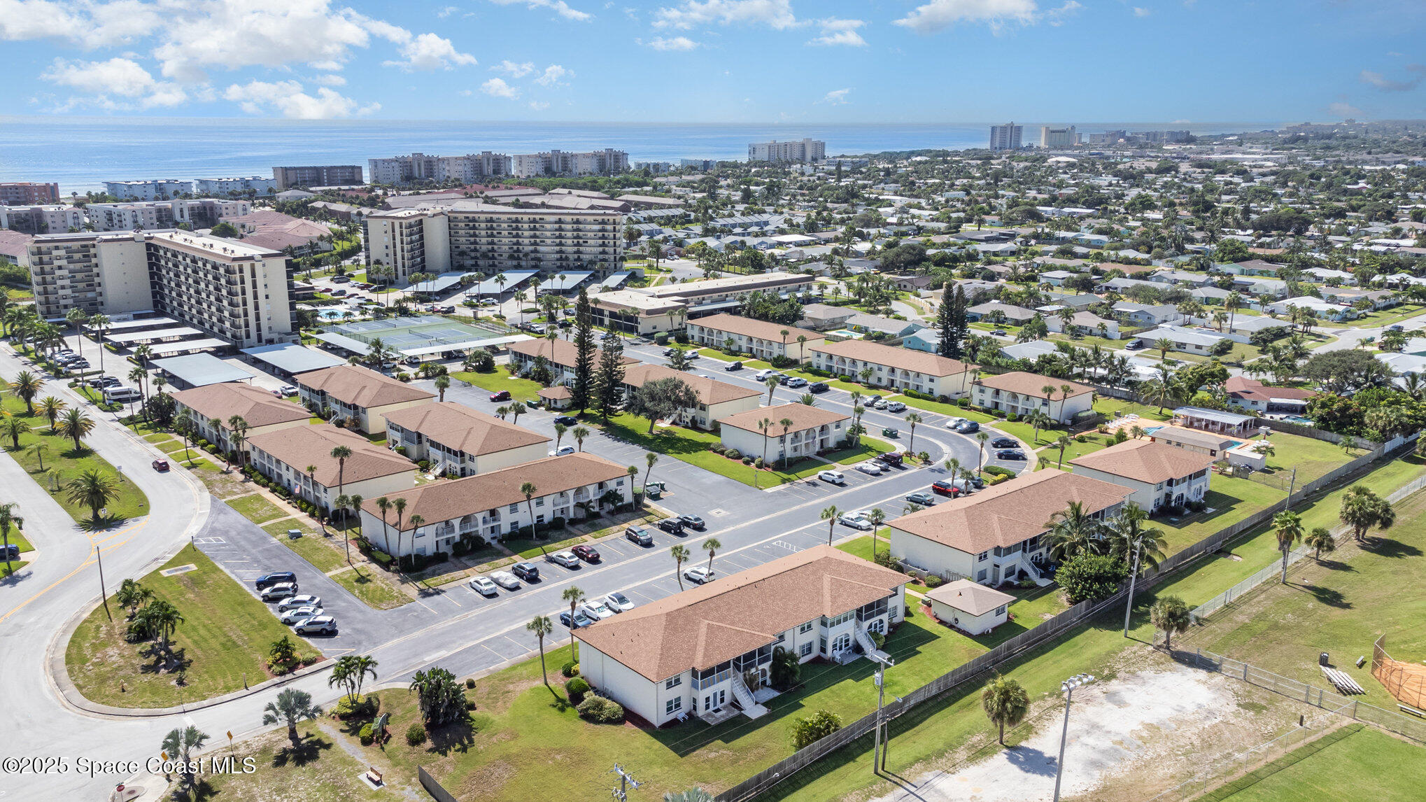 415 School Road, Unit 70 Indian Harbour Beach, FL 32937 - Photo 16 of 16 an aerial view of residential houses with outdoor space