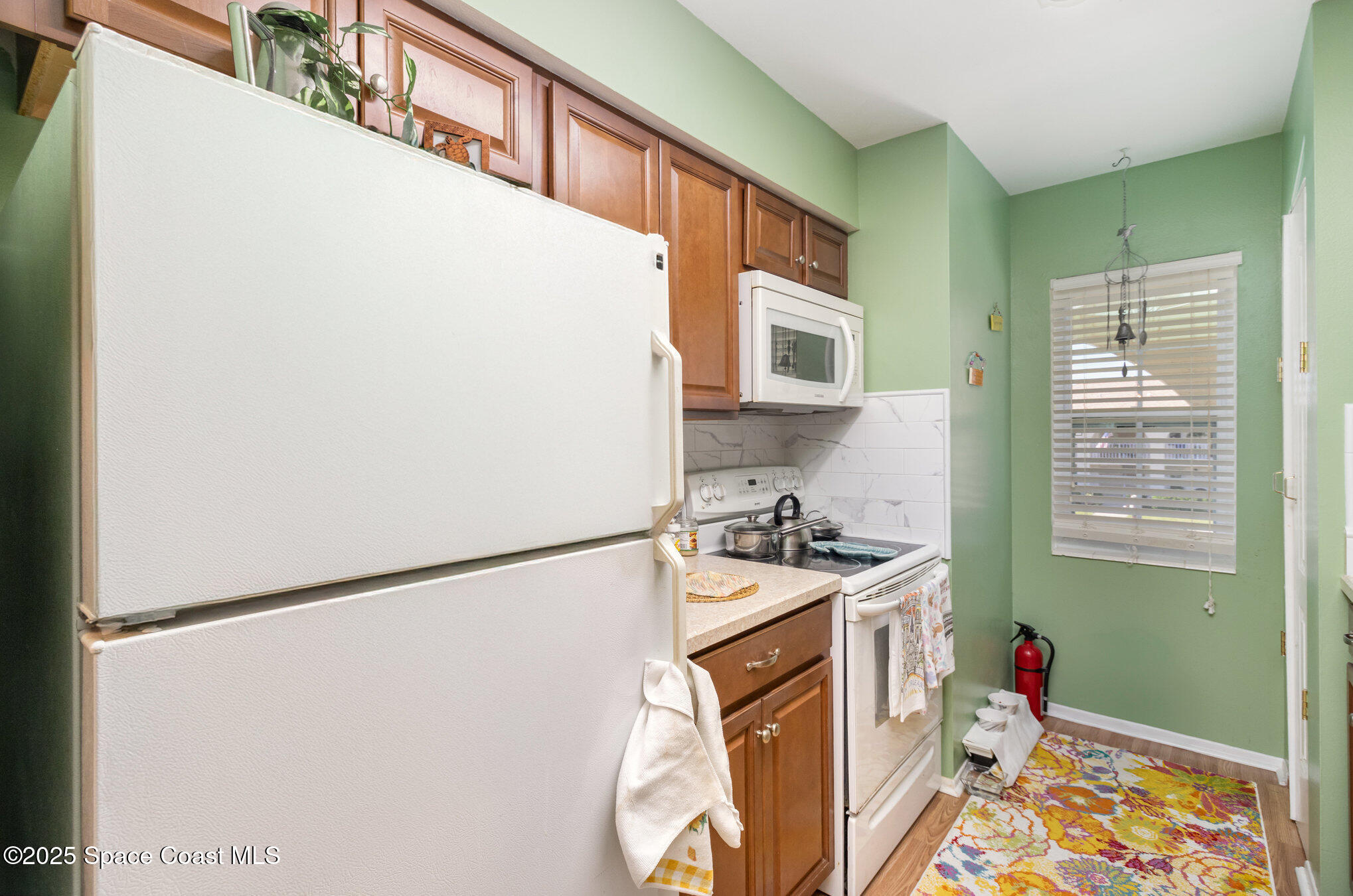 415 School Road, Unit 70 Indian Harbour Beach, FL 32937 - Photo 7 of 16 a utility room with dryer and washer