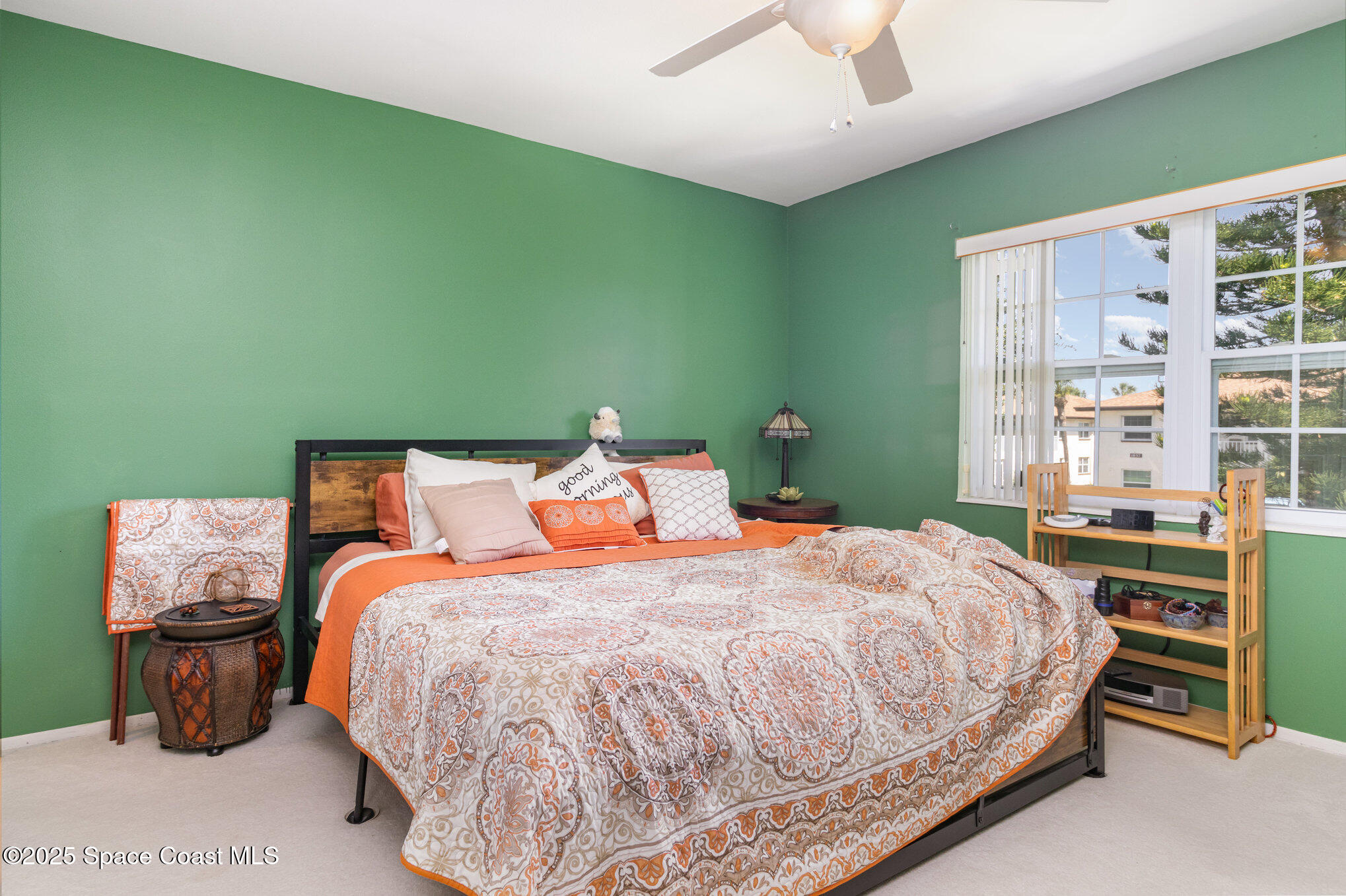 415 School Road, Unit 70 Indian Harbour Beach, FL 32937 - Photo 10 of 16 a bedroom with a bed and a large window