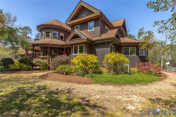 a view of swimming pool with outdoor seating and lake view