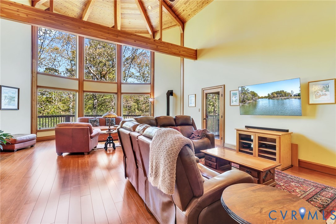 176 Baypointe Court Reedville, VA 22539 - Photo 17 of 59 a bedroom with furniture and a large window