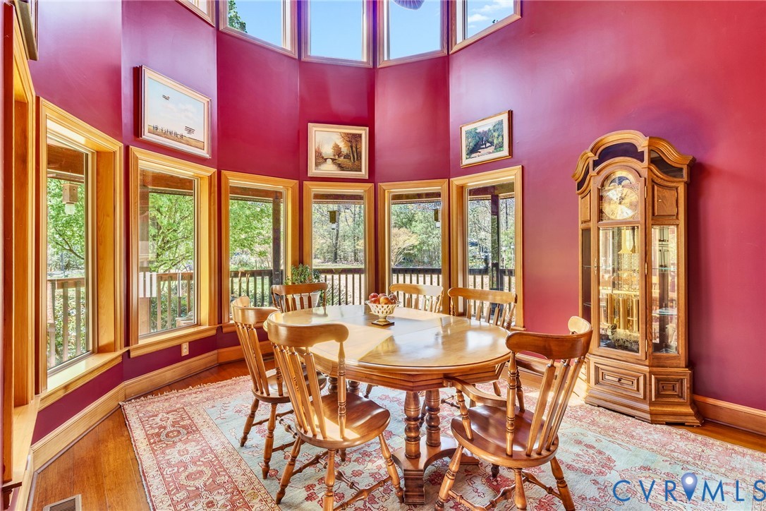 176 Baypointe Court Reedville, VA 22539 - Photo 30 of 59 a view of a dining room with furniture window and wooden floor