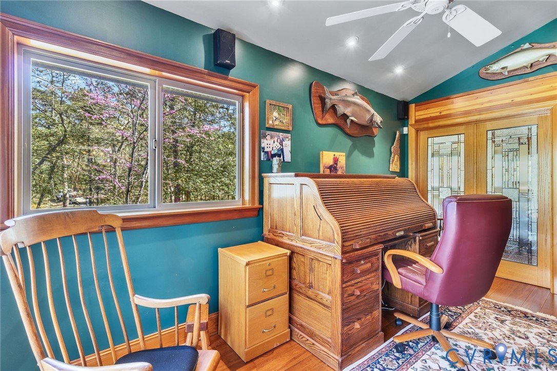 176 Baypointe Court Reedville, VA 22539 - Photo 39 of 59 a view of a dining room with furniture a chandelier and wooden floor