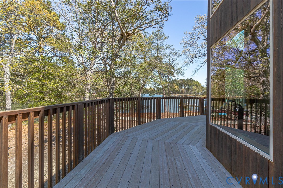 176 Baypointe Court Reedville, VA 22539 - Photo 51 of 59 a balcony with wooden floor and fence