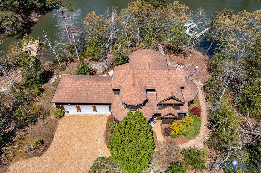 176 Baypointe Court Reedville, VA 22539 - Photo 58 of 59 an aerial view of a house with swimming pool and large trees