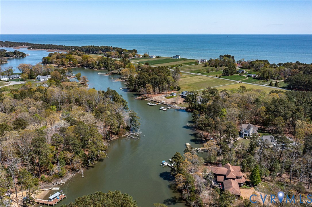 176 Baypointe Court Reedville, VA 22539 - Photo 8 of 59 an aerial view of ocean and residential houses with outdoor space