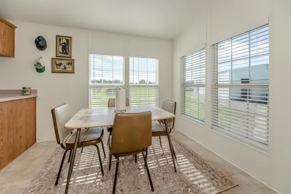 a spacious bedroom with a bed and a couch