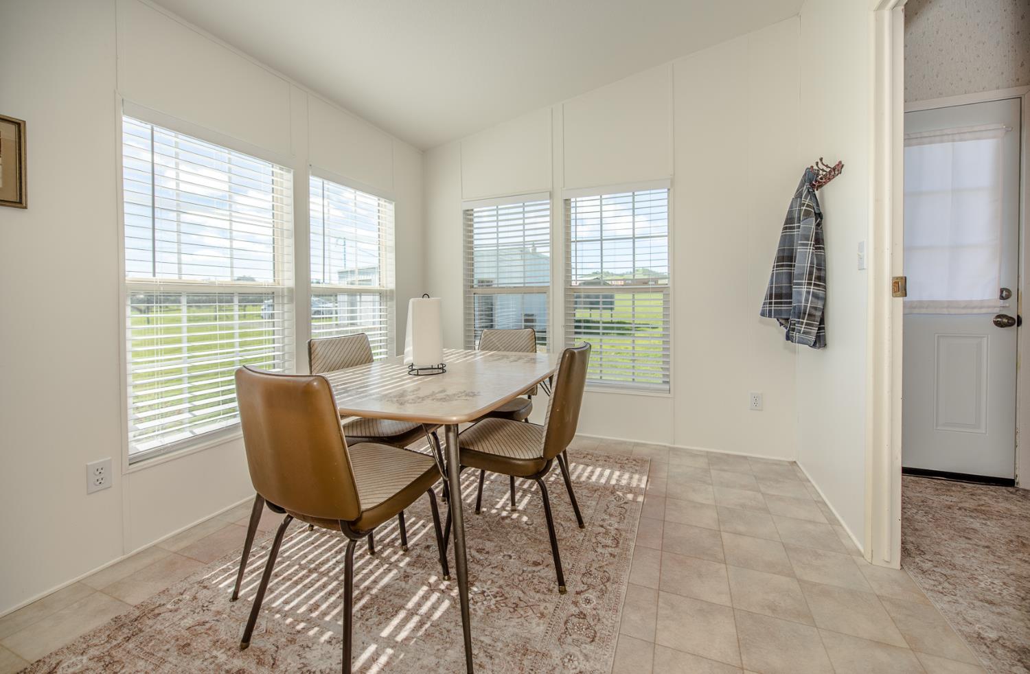 12076 County Road 84A Capay, CA 95607 - Photo 21 of 46 a dining room with furniture and wooden floor