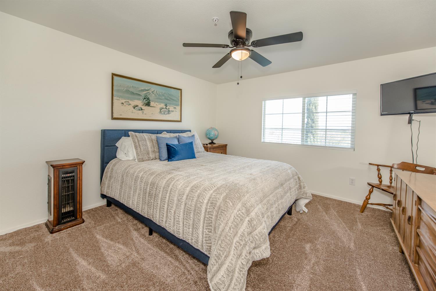 12076 County Road 84A Capay, CA 95607 - Photo 23 of 46 a bedroom with a bed and a chandelier