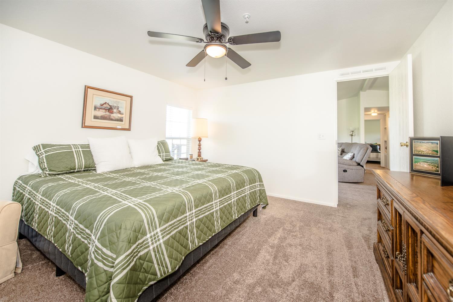 12076 County Road 84A Capay, CA 95607 - Photo 25 of 46 a bedroom with a bed and a chandelier