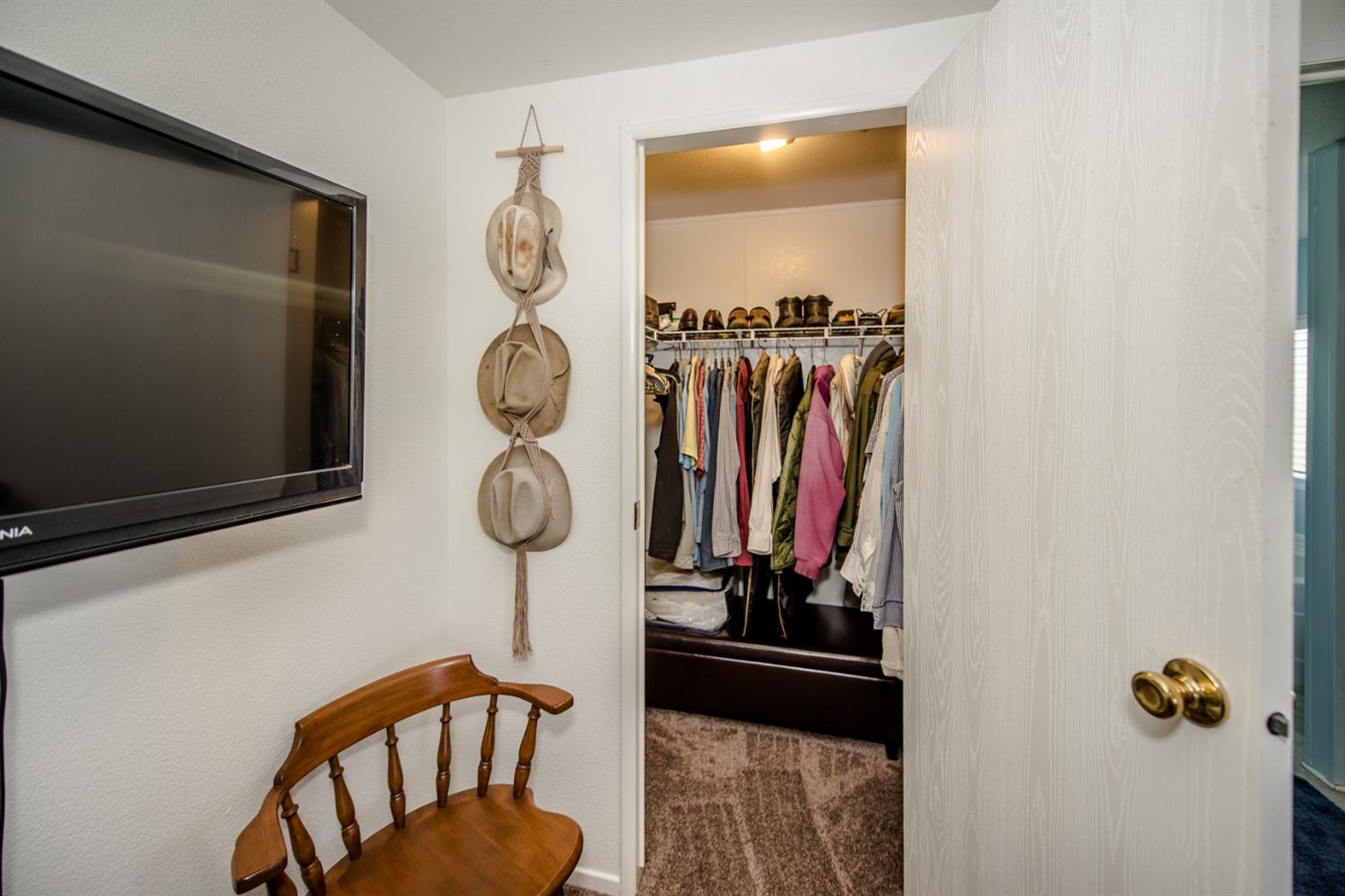 12076 County Road 84A Capay, CA 95607 - Photo 26 of 46 a view of walk in closet with clothes and shoes