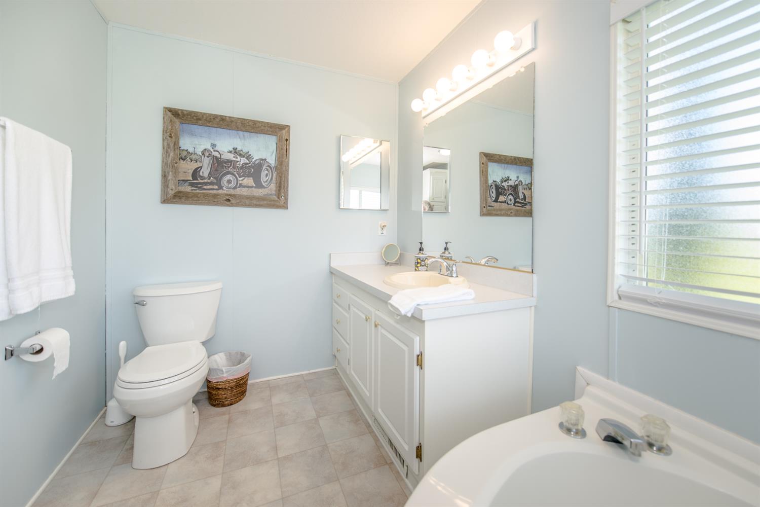 12076 County Road 84A Capay, CA 95607 - Photo 29 of 46 a bathroom with a toilet sink and mirror
