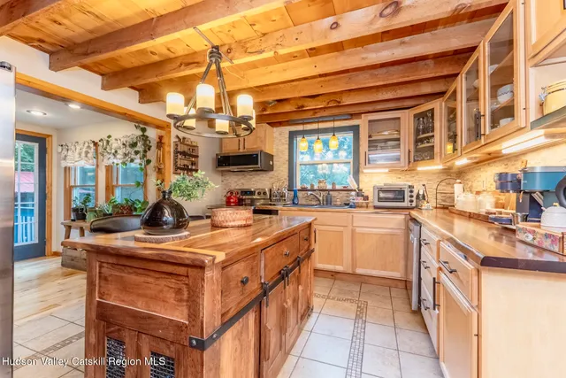 a kitchen with stainless steel appliances granite countertop a sink and cabinets