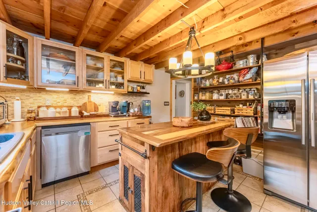 a kitchen with a table and chairs in it