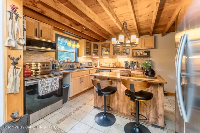 a kitchen with counter top space and appliances