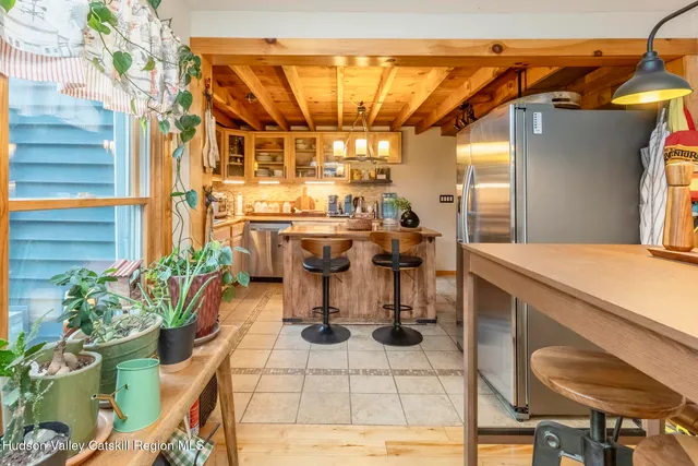 a view of a patio with dining table and chairs