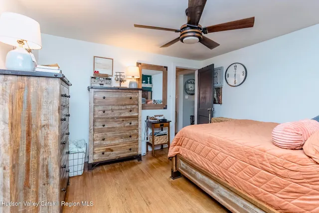 a bedroom with a bed and cabinets