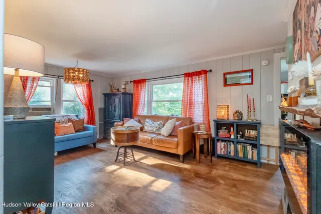 a bedroom with furniture and a window