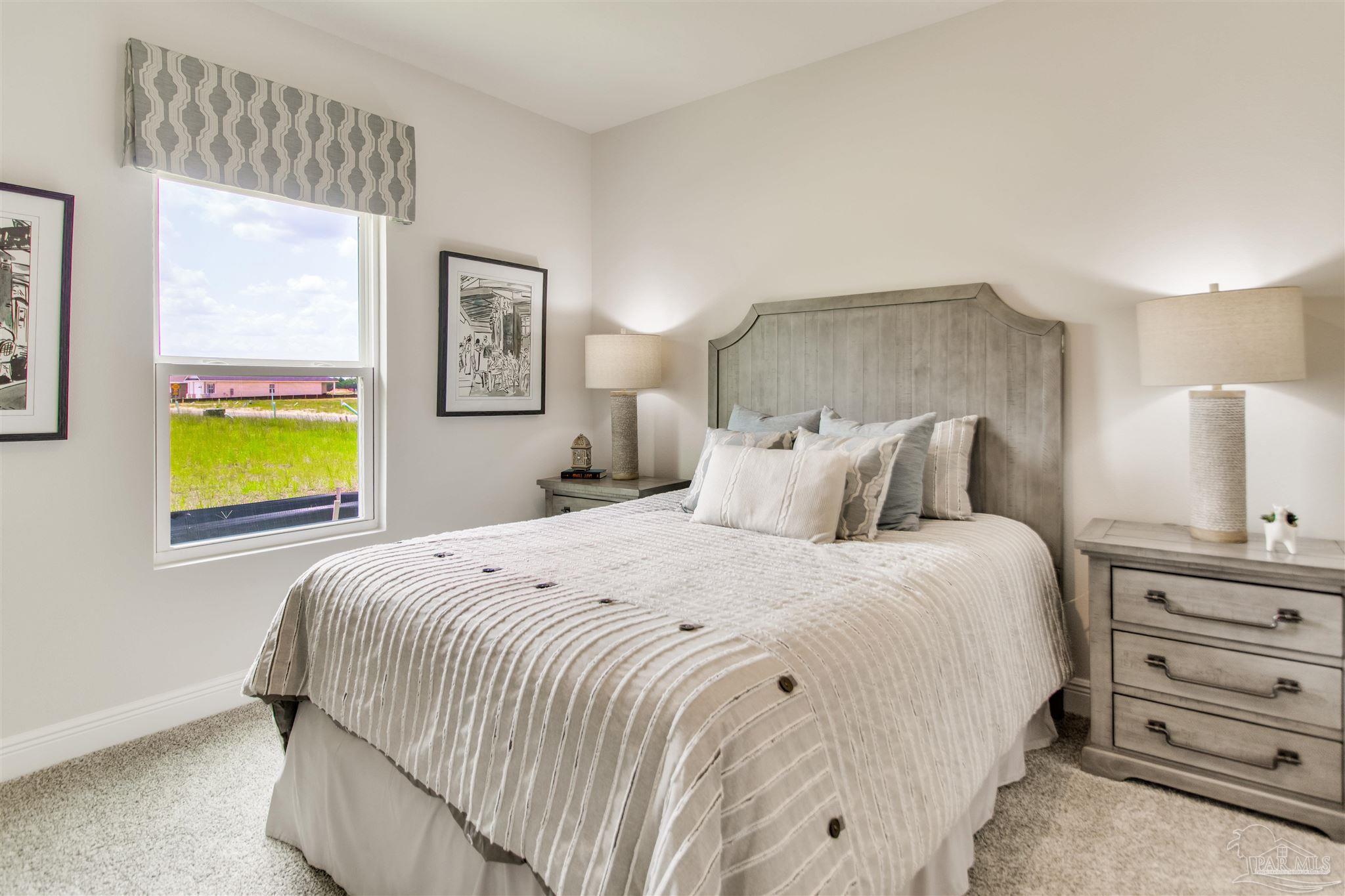 4753 Redhead Court Pace, FL 32571 - Photo 12 of 44 a bedroom with a bed and a window