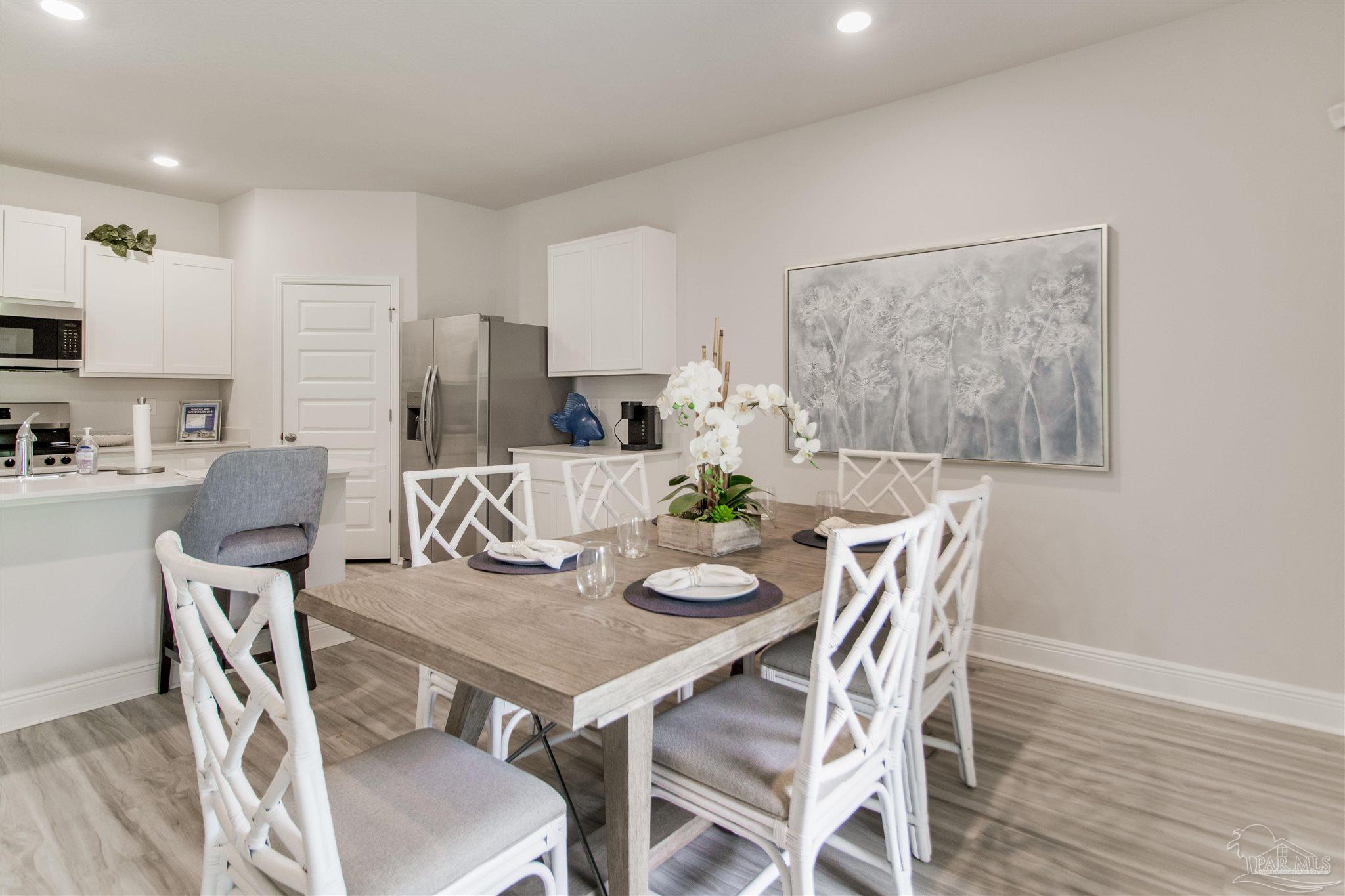 4753 Redhead Court Pace, FL 32571 - Photo 20 of 44 a view of a dining room with furniture