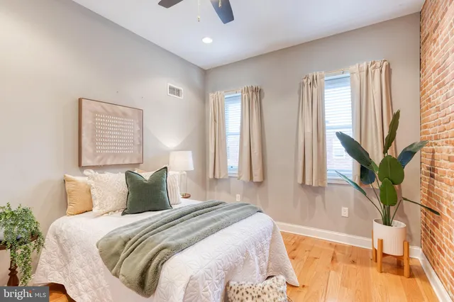 a bedroom with a large bed and a large window