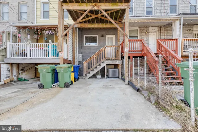 an front view of a house with deck