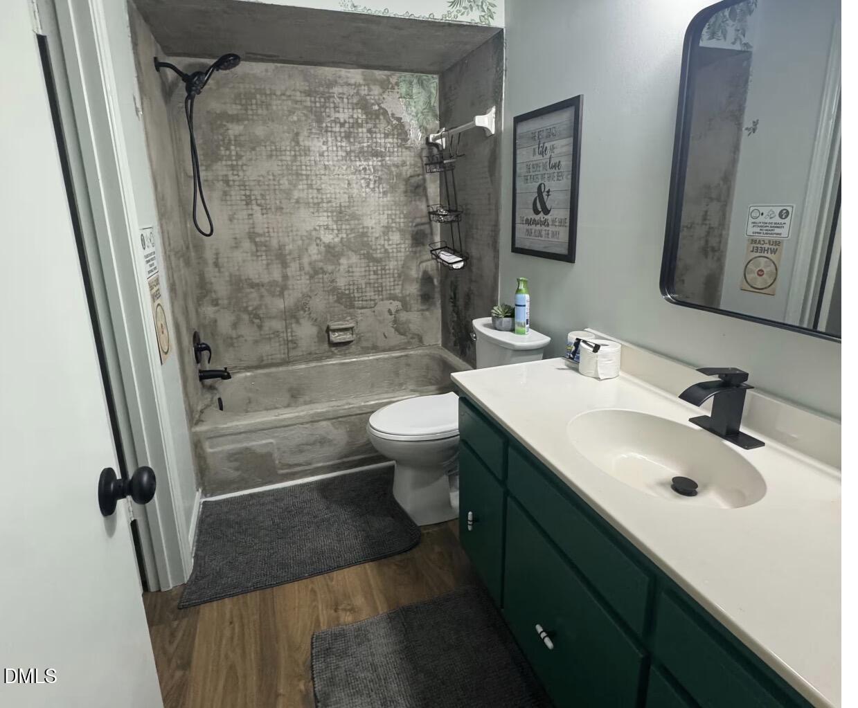 6369 New Market Way Raleigh, NC 27615 - Photo 8 of 14 a bathroom with a sink toilet and shower