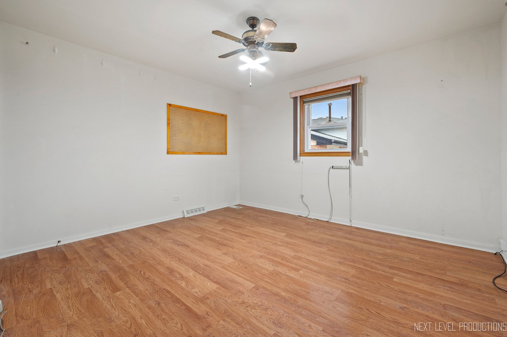 10336 Leslie Lane Chicago Ridge, IL 60415 - Photo 17 of 28 a view of an empty room with a window