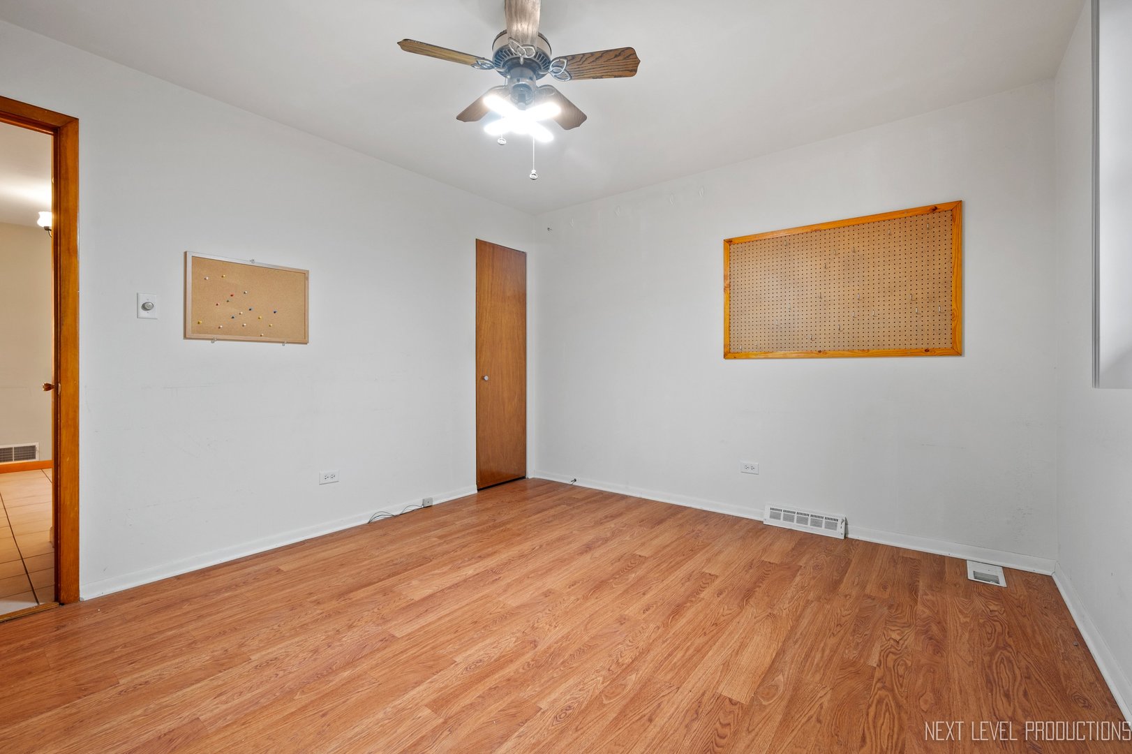 10336 Leslie Lane Chicago Ridge, IL 60415 - Photo 18 of 28 a view of an empty room with wooden floor