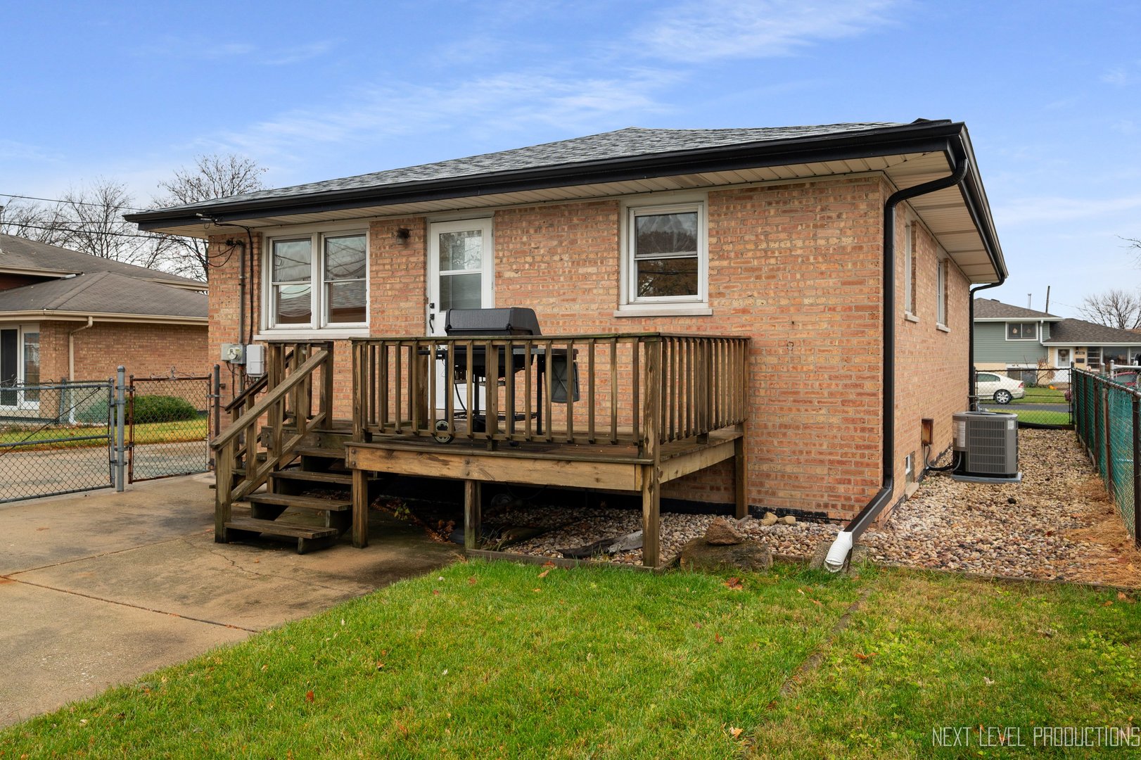 10336 Leslie Lane Chicago Ridge, IL 60415 - Photo 26 of 28 a view of backyard with deck and a garden