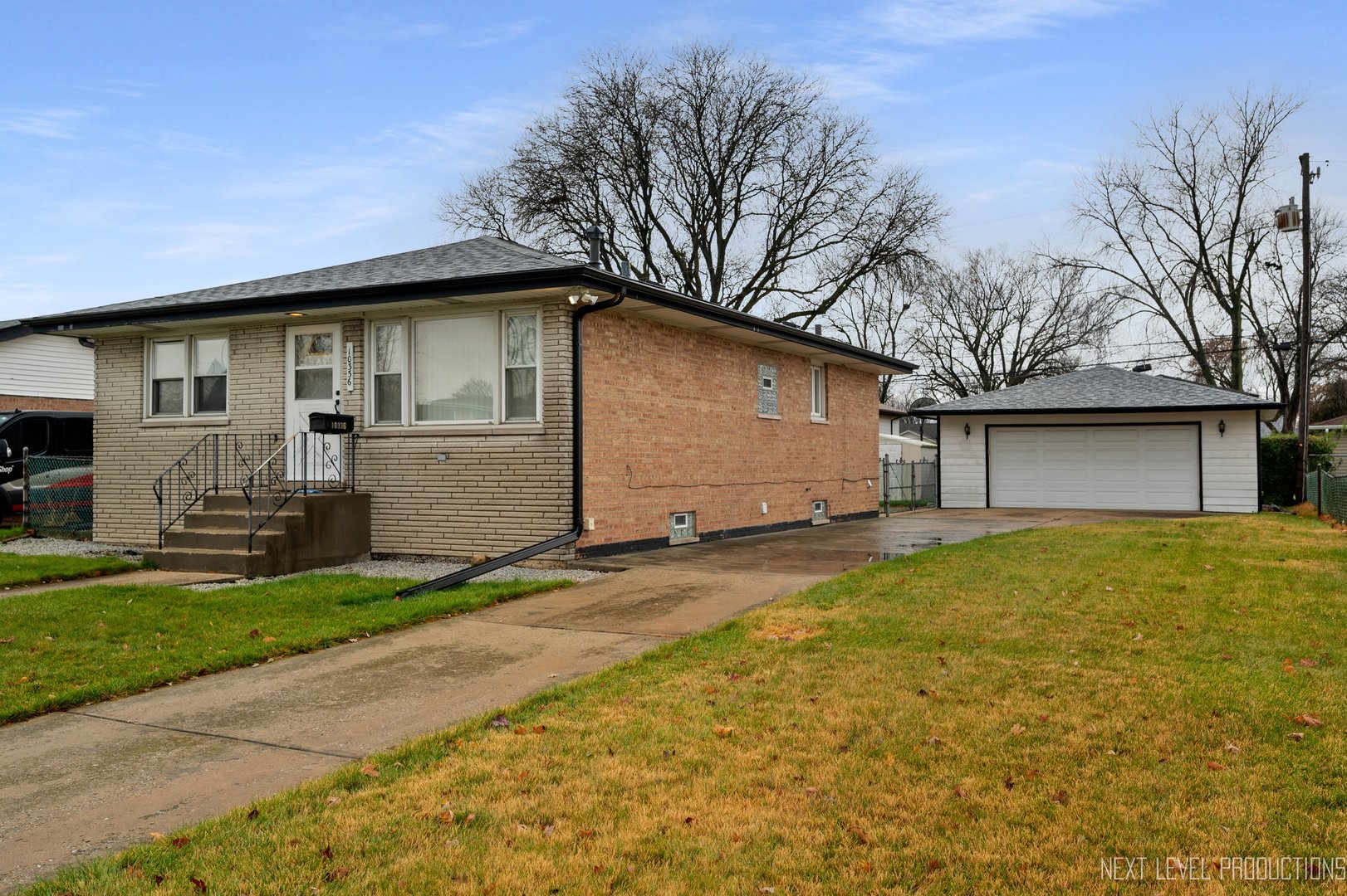 10336 Leslie Lane Chicago Ridge, IL 60415 - Photo 28 of 28 a backyard of a house with yard and garage