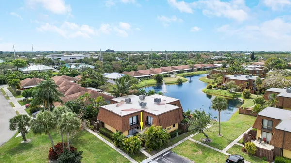 an aerial view of a house with lake view