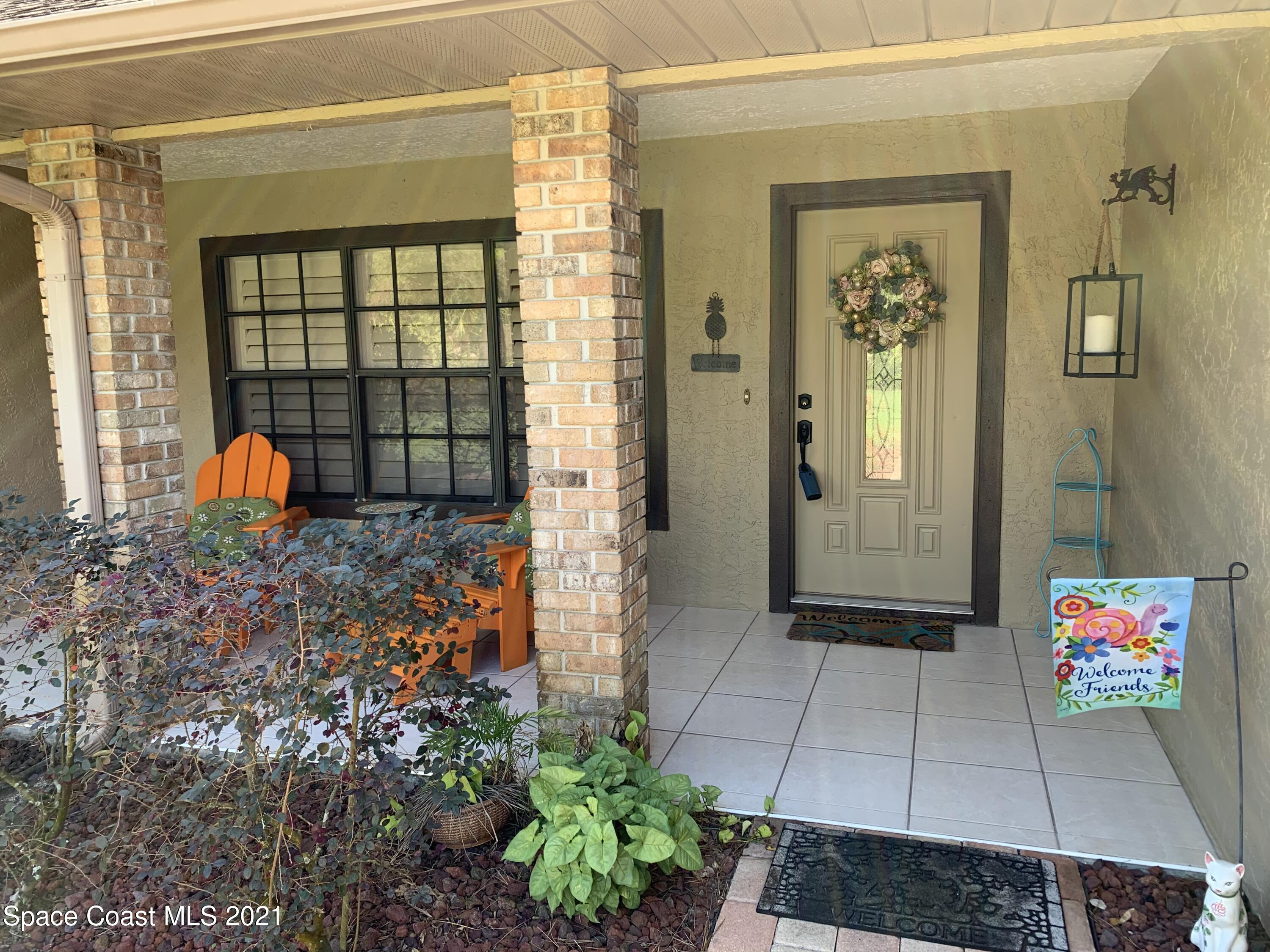3485 Grant Line Road Mims, FL 32754 - Photo 3 of 40 an outdoor space with sliding door and wooden floor