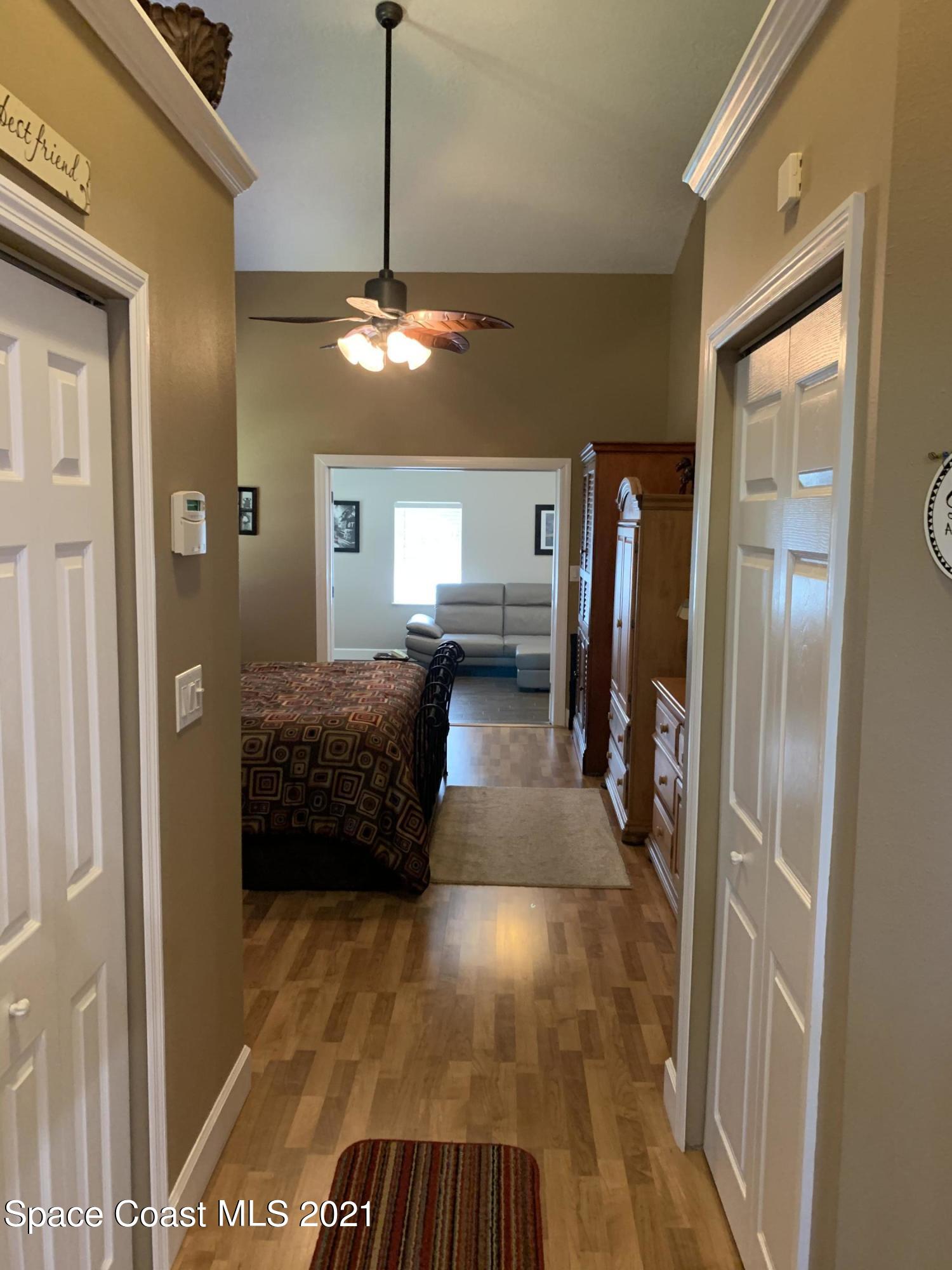 3485 Grant Line Road Mims, FL 32754 - Photo 22 of 40 a view of a hallway with a livingroom and dining room