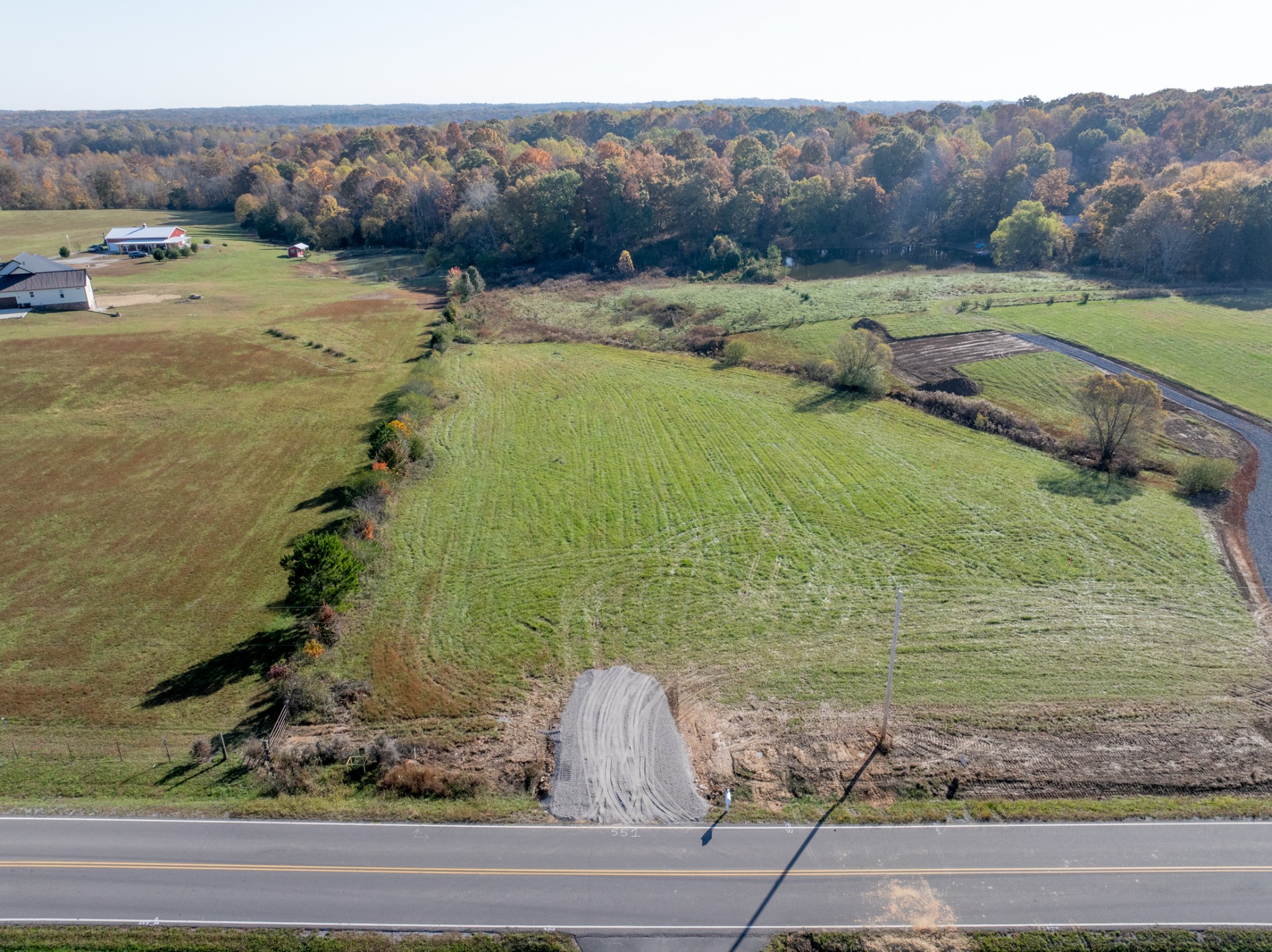 551 Buddy Road Burns, TN 37029 - Photo 6 of 29 a view of a garden with a lake