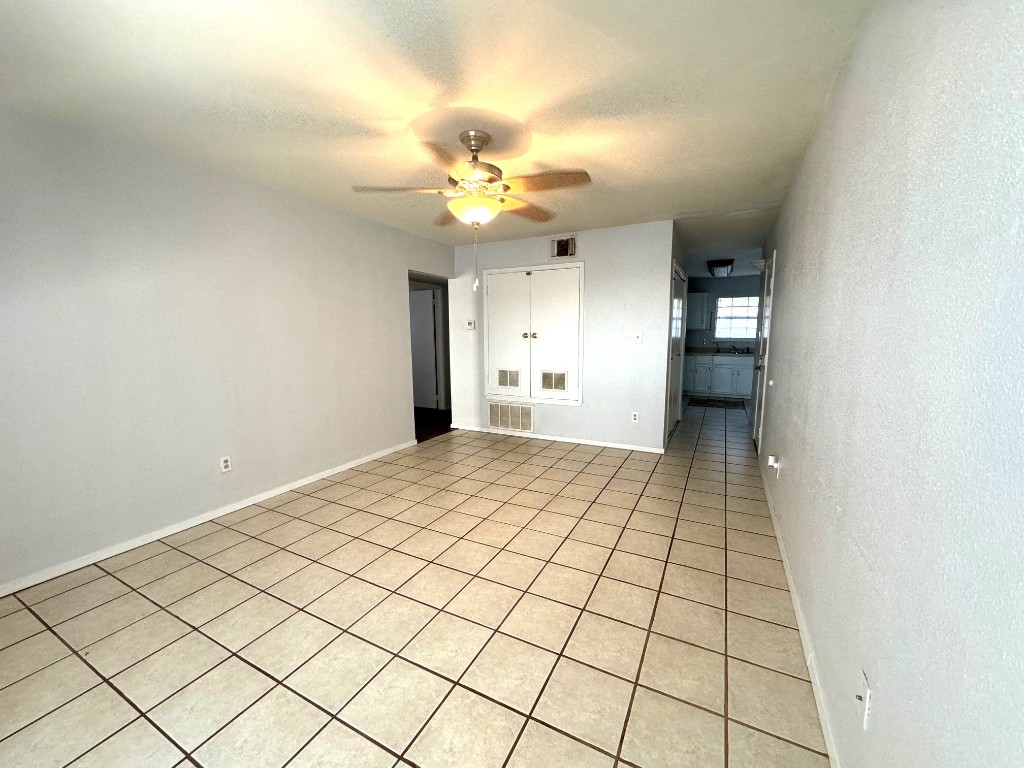 1307 Center Street Lockhart, TX 78644 - Photo 7 of 14 a view of an empty room and kitchen view