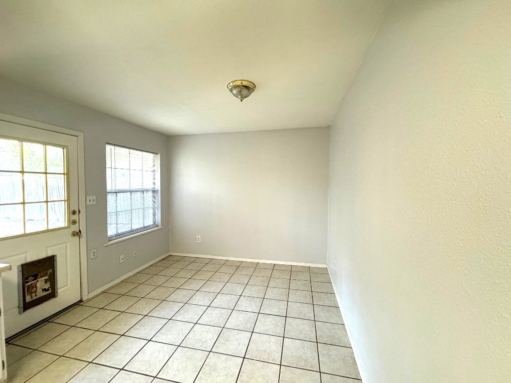 1307 Center Street Lockhart, TX 78644 - Photo 8 of 14 an empty room with windows