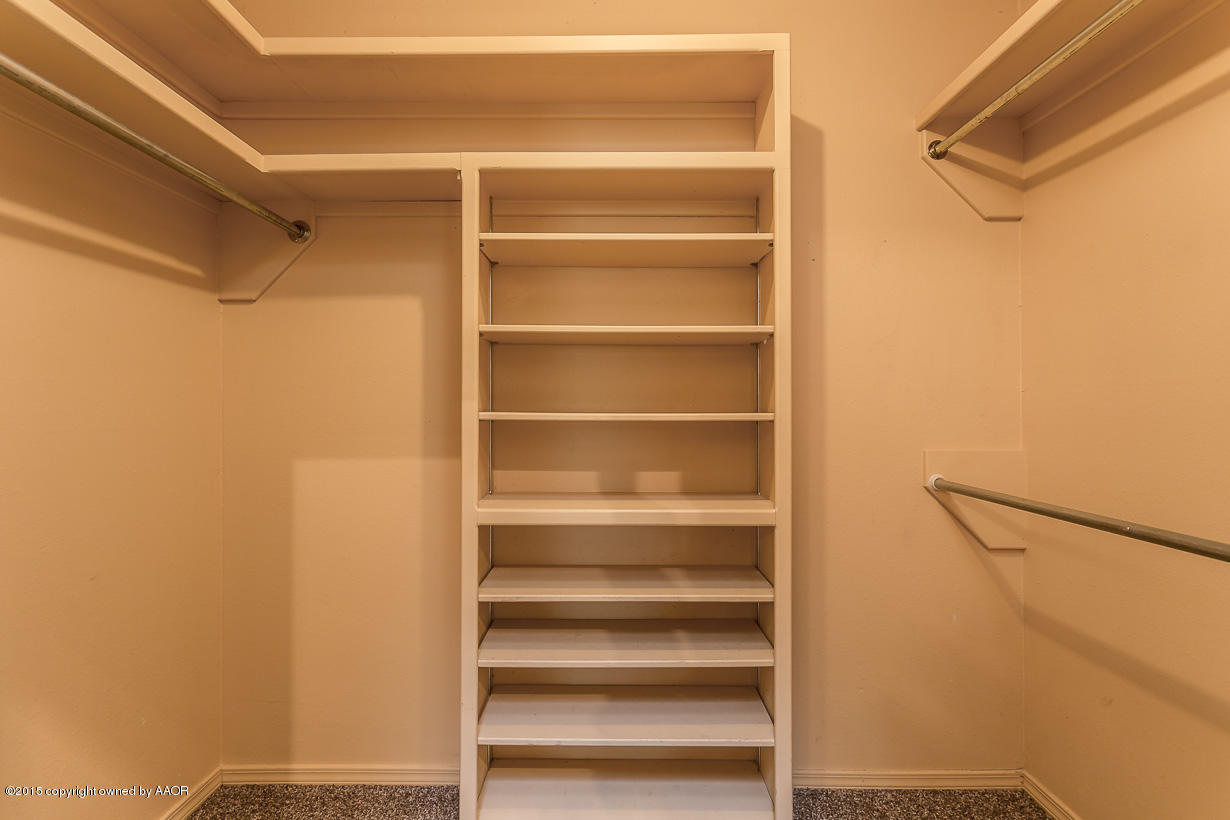 4203 Rondo Avenue Amarillo, TX 79110 - Photo 13 of 21 a view of walk in closet with empty racks