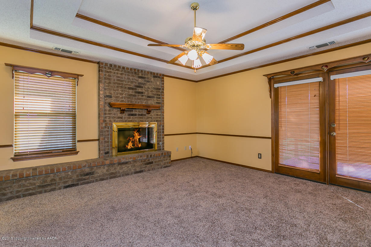 4203 Rondo Avenue Amarillo, TX 79110 - Photo 8 of 21 a view of an empty room with a fireplace