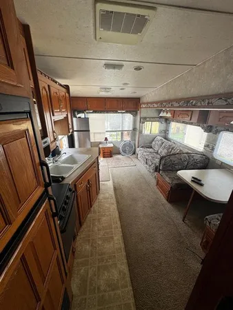 a kitchen with a sink and a stove top oven