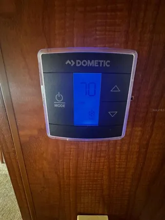 a bed sitting in a room next to a window